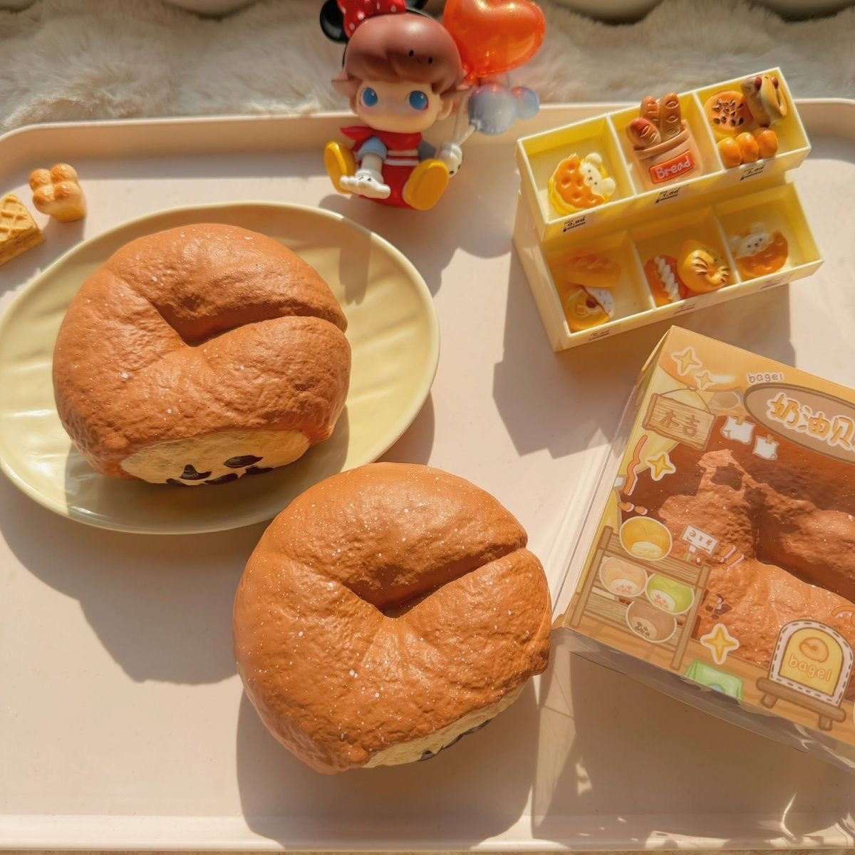 Bagel Slow-Rising Squishy – Brown Bread Ring with Cream Patch & Dark Chip Details