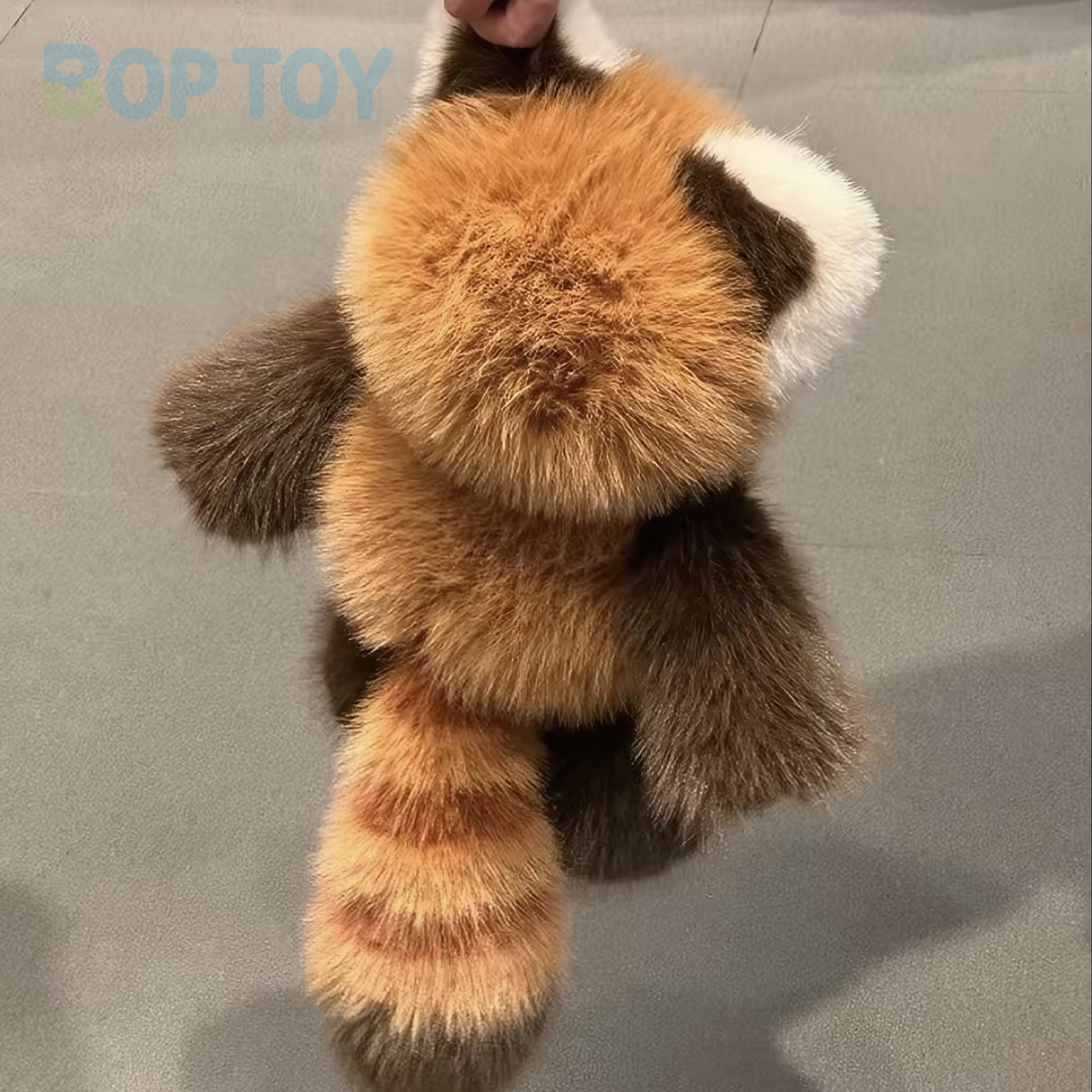 Fluffy red panda plush, actual back photograph