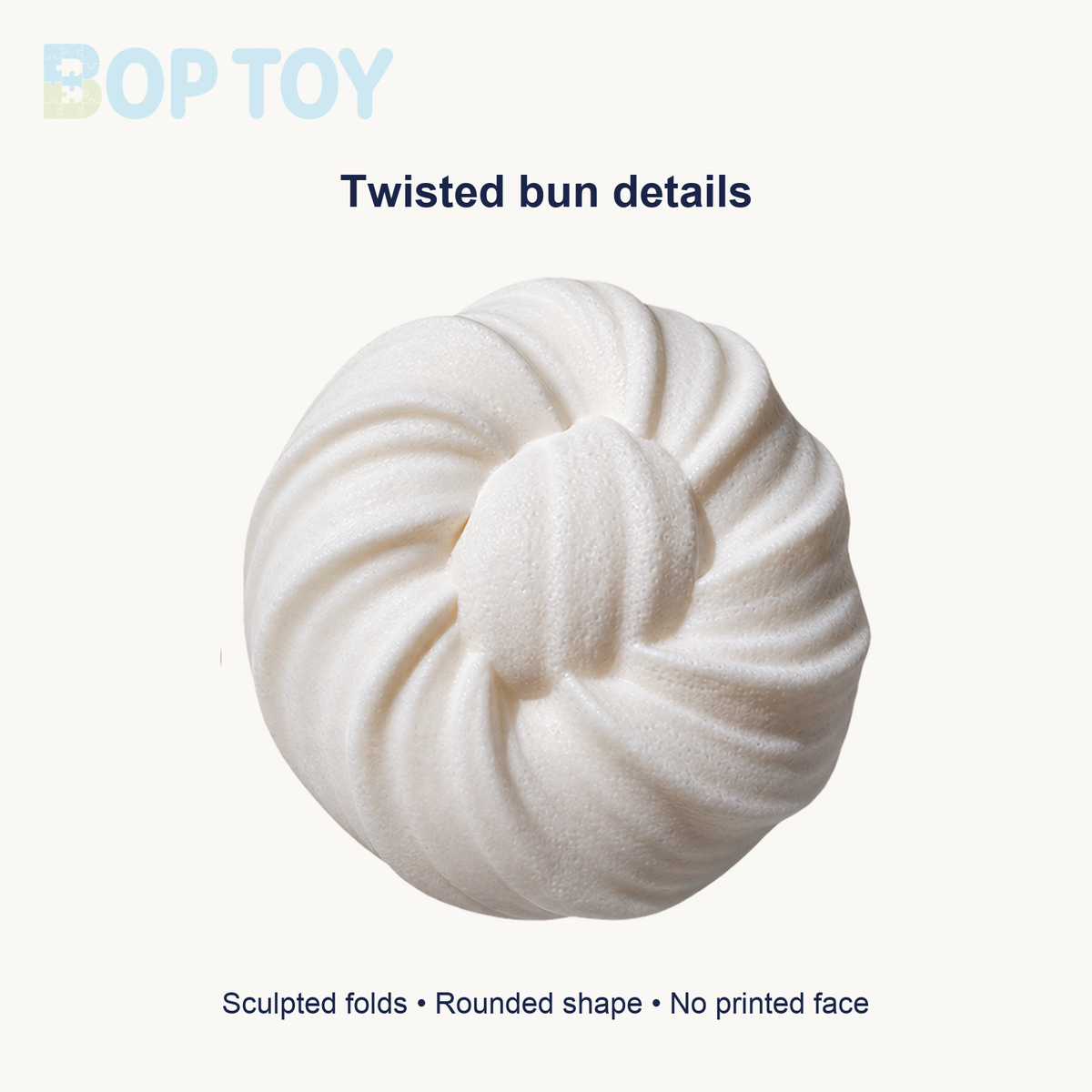 Close view of white bun original spiral folds and center knot