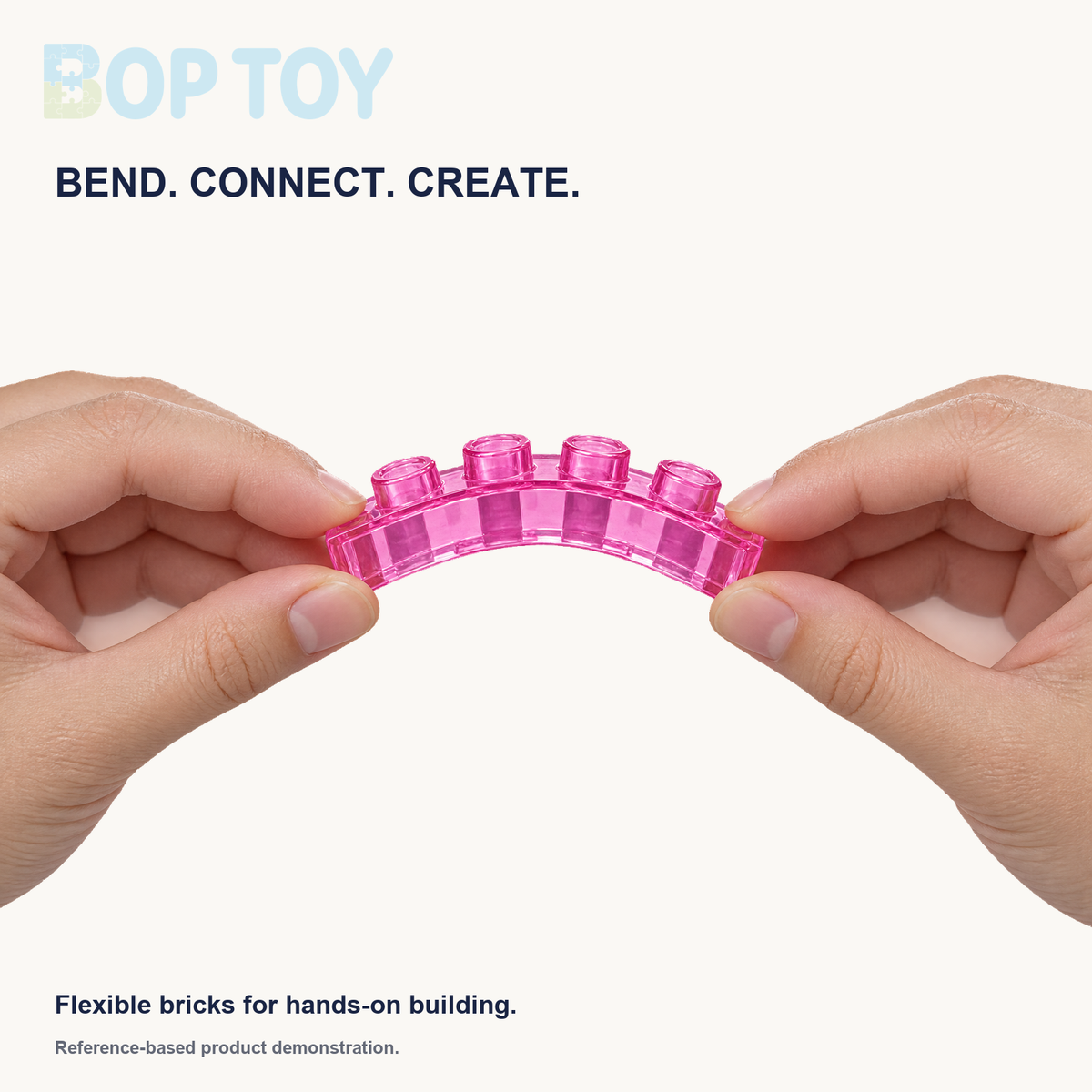 Reference-based demonstration of hands gently bending a translucent pink four-stud jelly brick