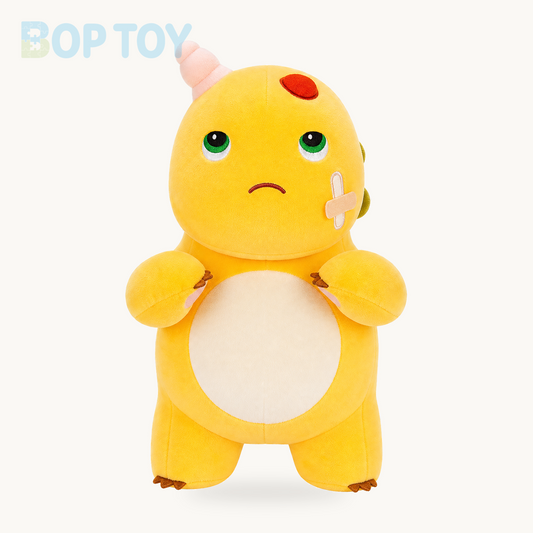 Funny bandaged yellow dinosaur plush, full front view