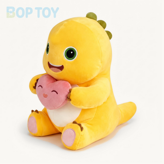 Soft yellow dinosaur plush holding a pink heart on a cream background