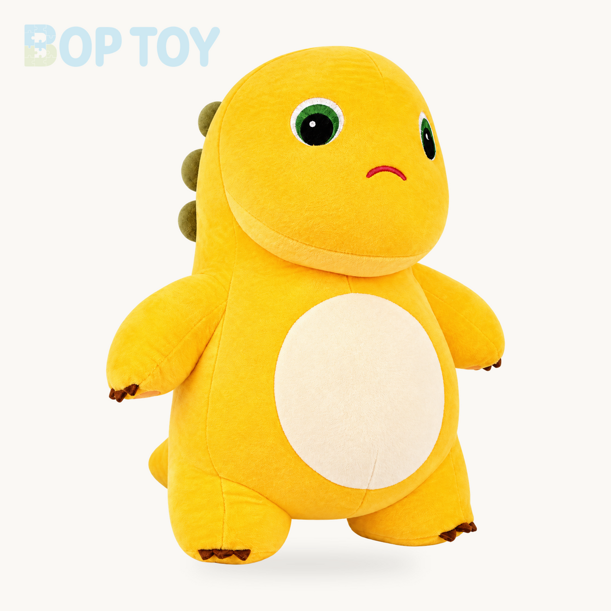 Frowning yellow dinosaur plush toy, three-quarter front view
