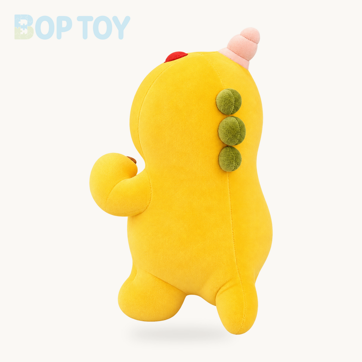 Yellow dinosaur plush rear angle showing three olive back bumps