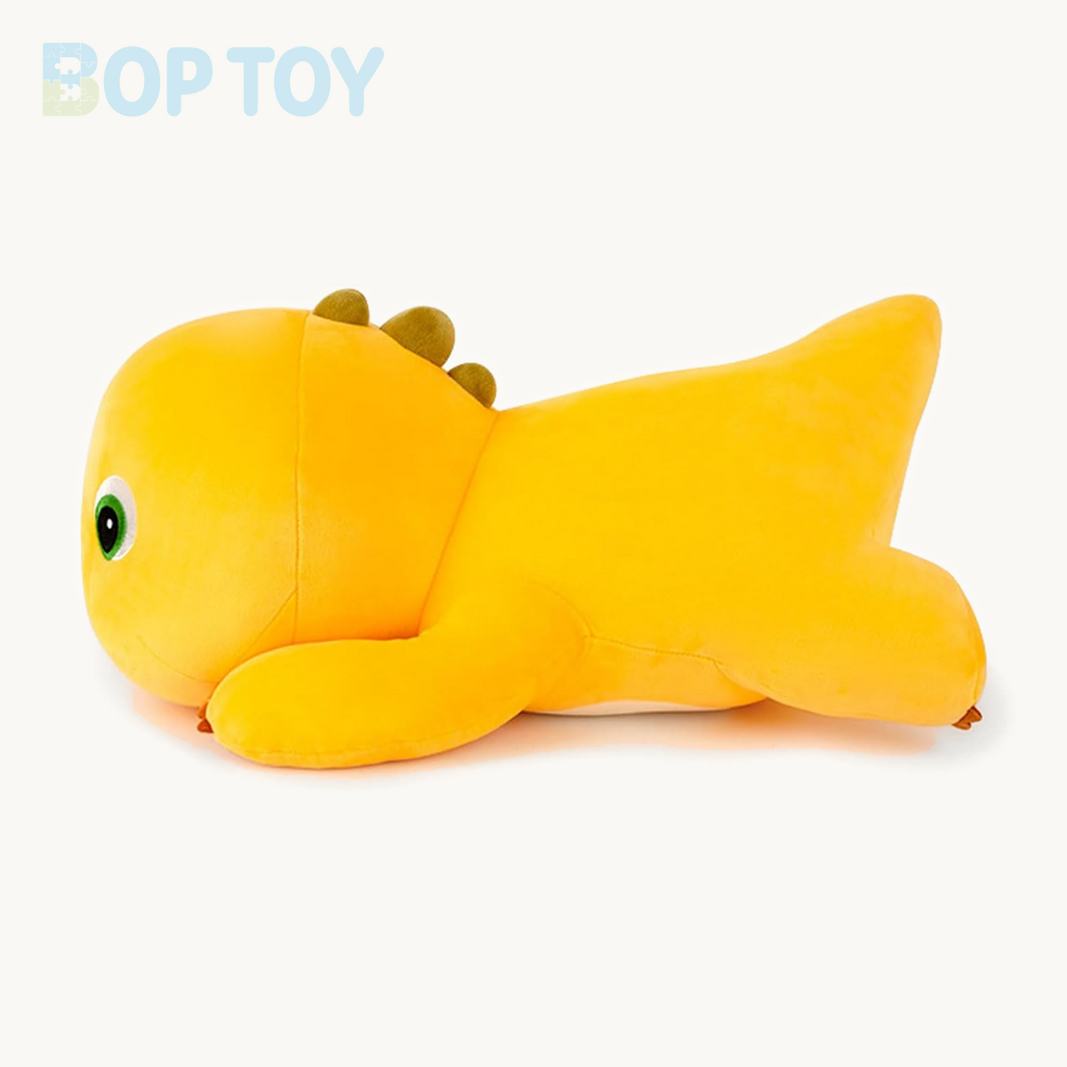 Lying yellow dinosaur plush toy side profile and tail