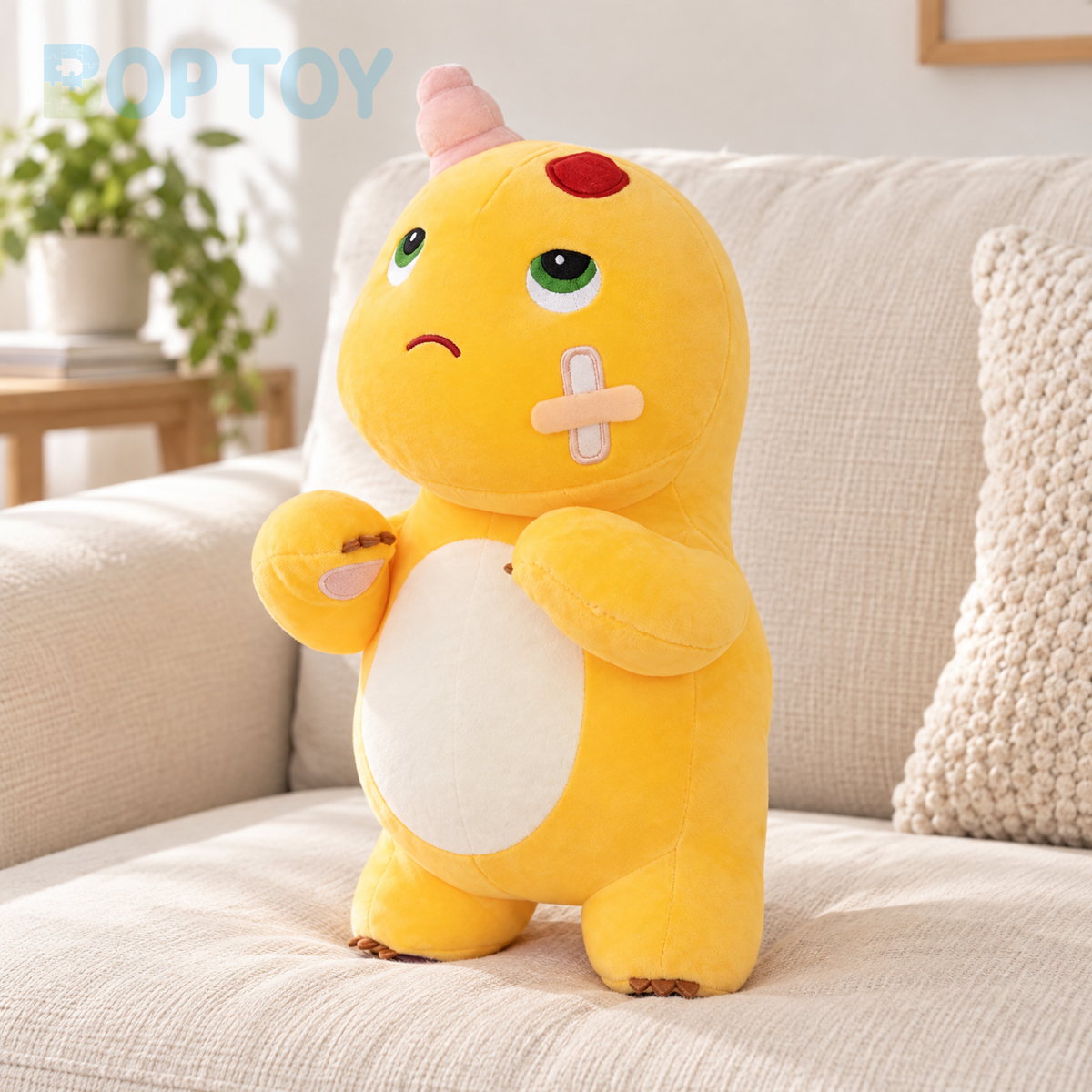 Funny yellow dinosaur plush standing on a cream sofa cushion