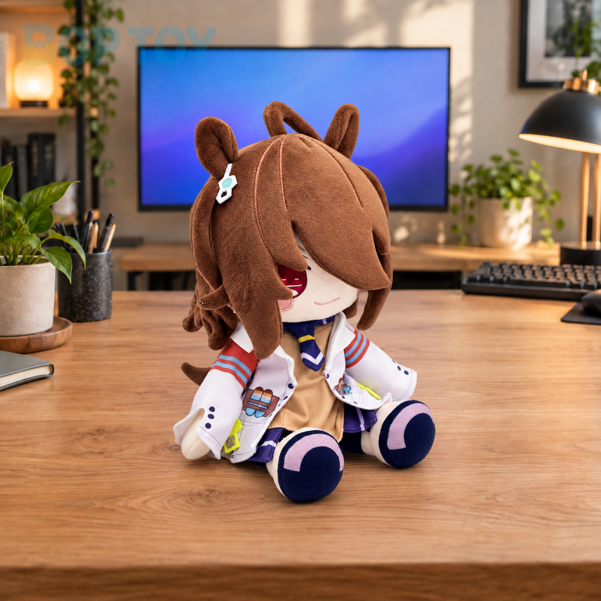 Brown-haired plush doll seated on a desk - BOP TOY