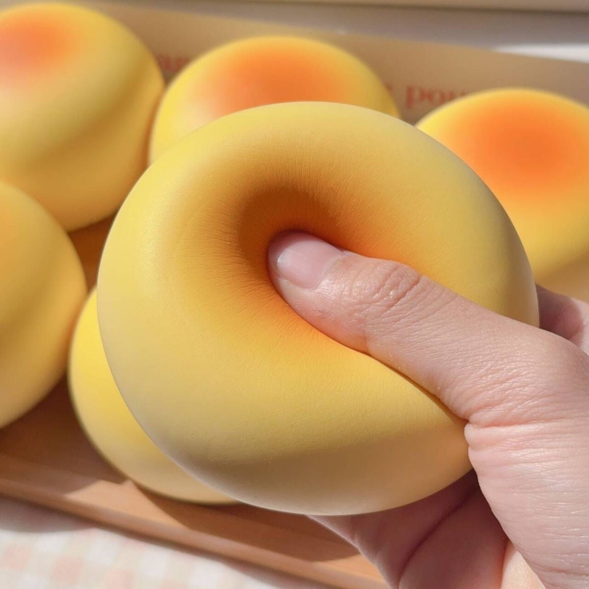 Round Bread Bun Slow-Rising Squishy – Pale Yellow Bakery-Inspired Dome with a Golden Orange Top and Smooth Rounded Shape