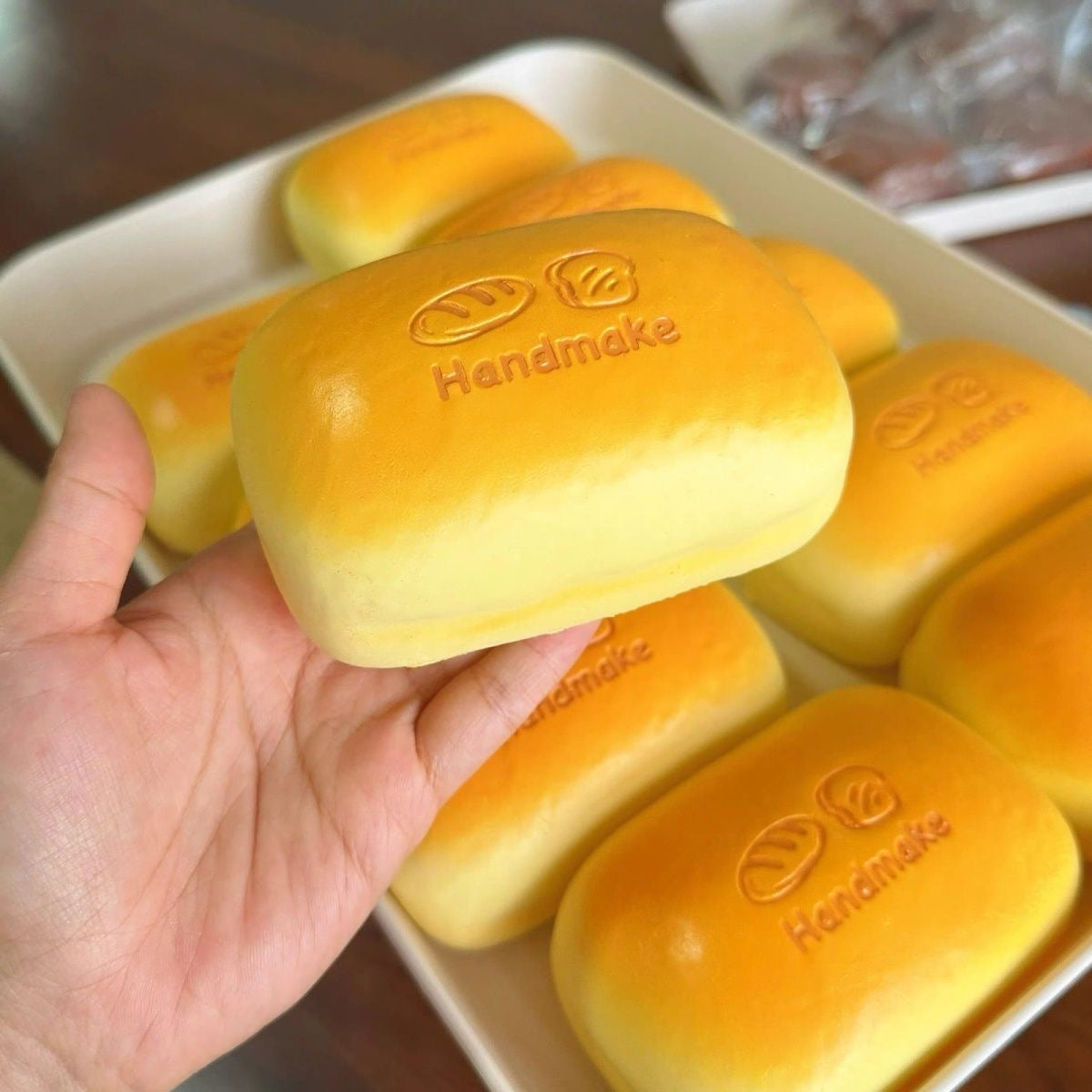 Golden Bread Loaf Slow-Rising Squishy – Rounded Rectangular Bun with Embossed Handmake Lettering and Two Bread Icons