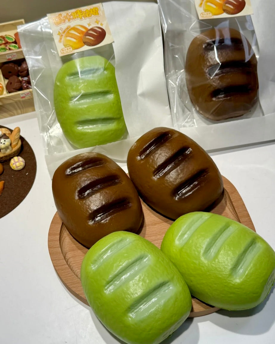Oval Bread Slow-Rising Squishy – Brown, Matcha Green or Two-Color Pair, Glossy Bakery-Inspired Squeeze Toy