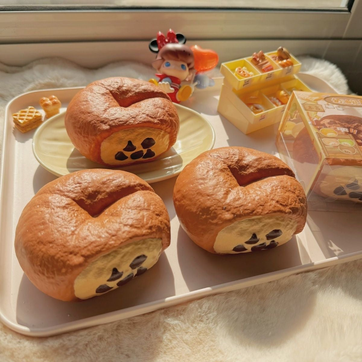 Bagel Slow-Rising Squishy – Brown Bread Ring with Cream Patch & Dark Chip Details