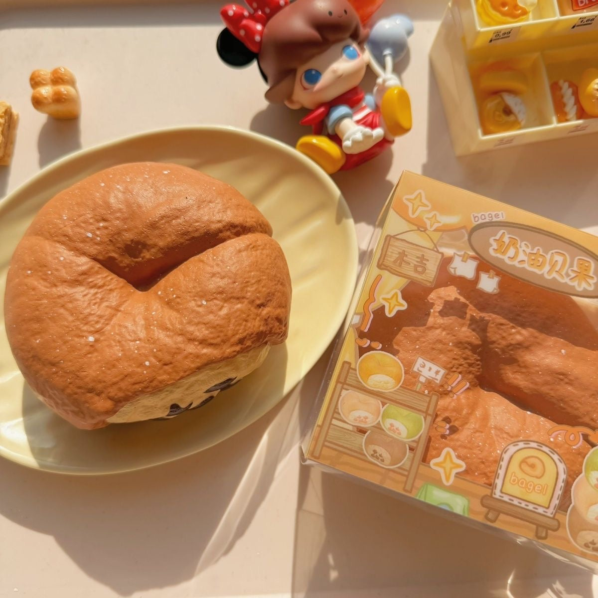 Bagel Slow-Rising Squishy – Brown Bread Ring with Cream Patch & Dark Chip Details