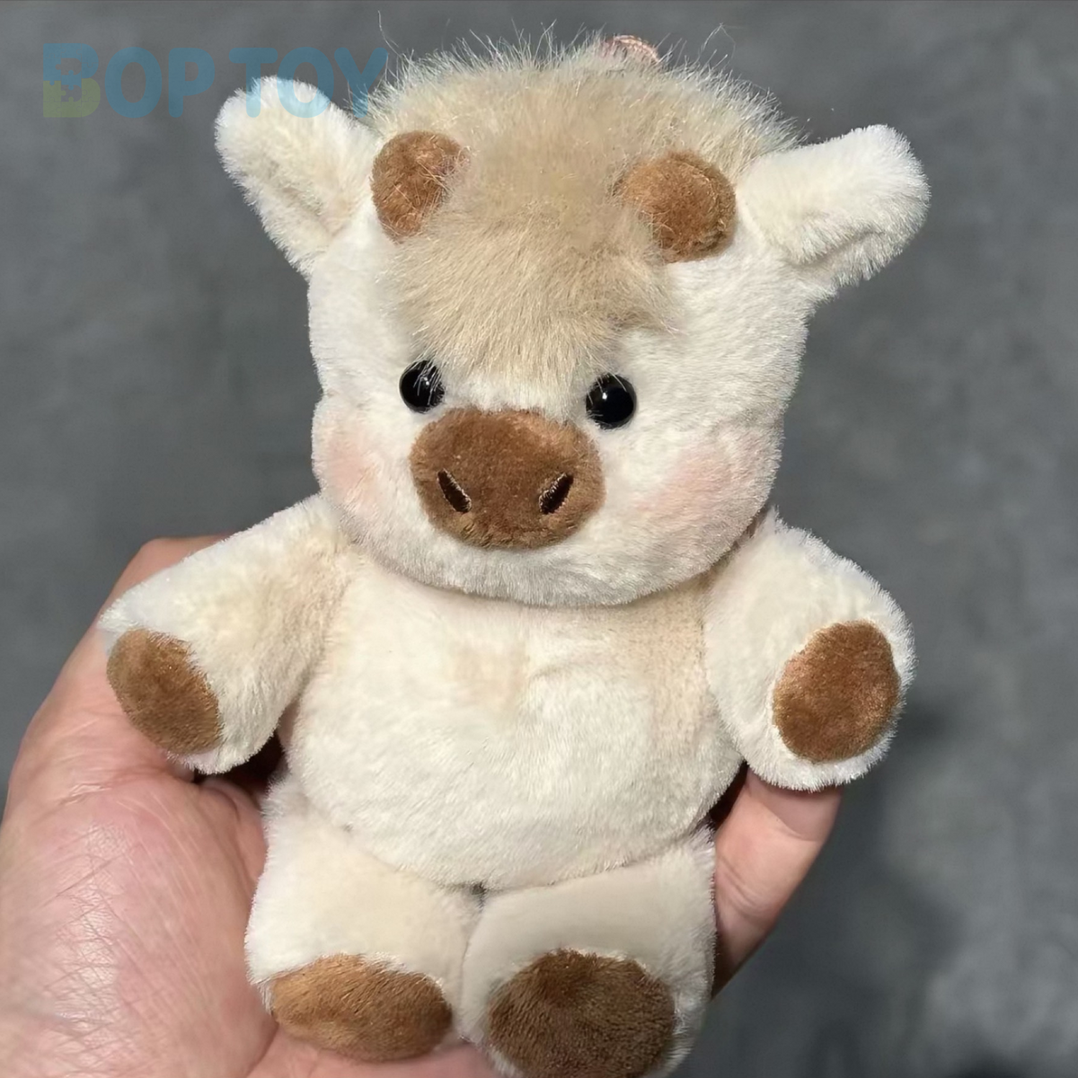Light Khaki Highland Cow plush bag charm, actual product photograph