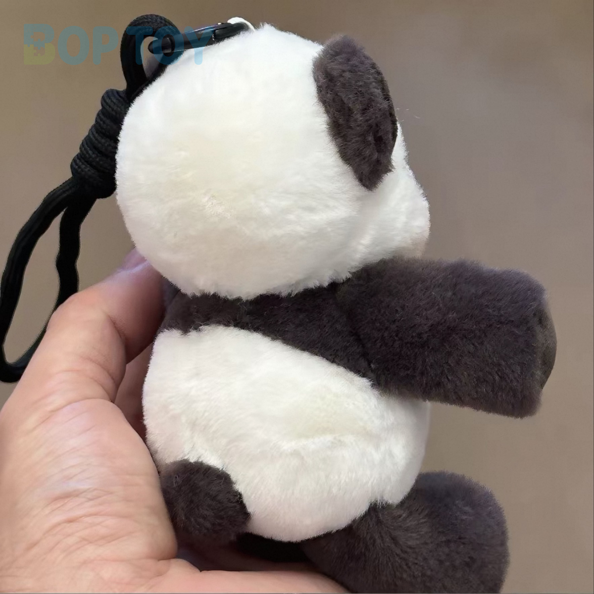 Panda plush bag charm, actual rear view showing black clip and attachment