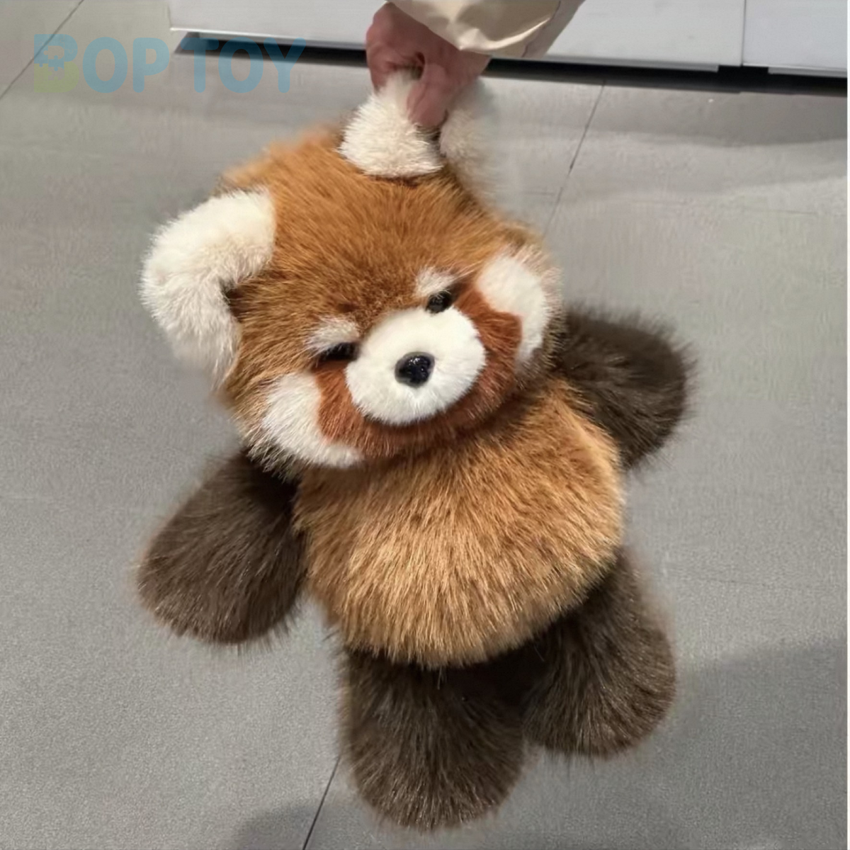 Fluffy red panda plush, actual short photograph