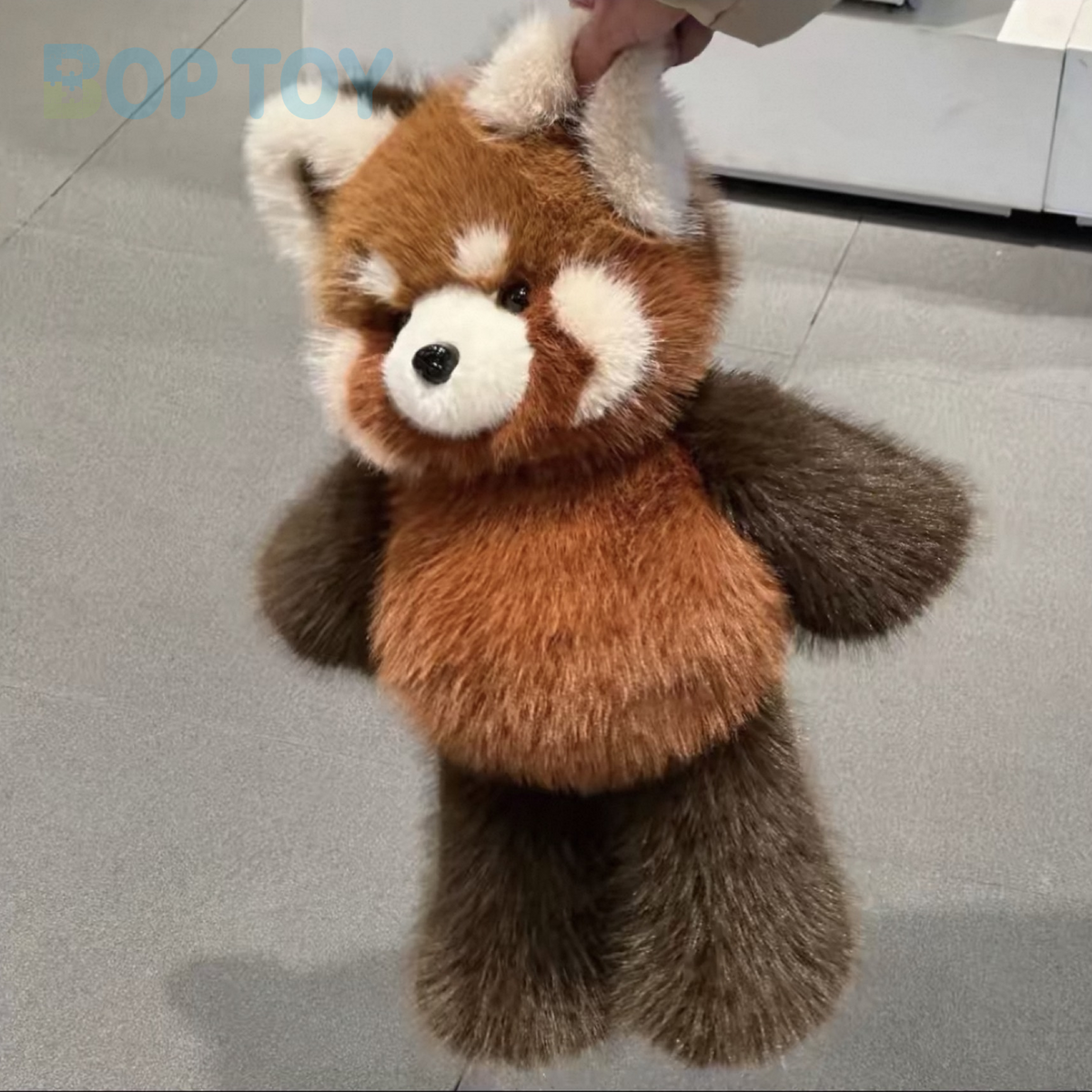 Fluffy red panda plush, actual long photograph