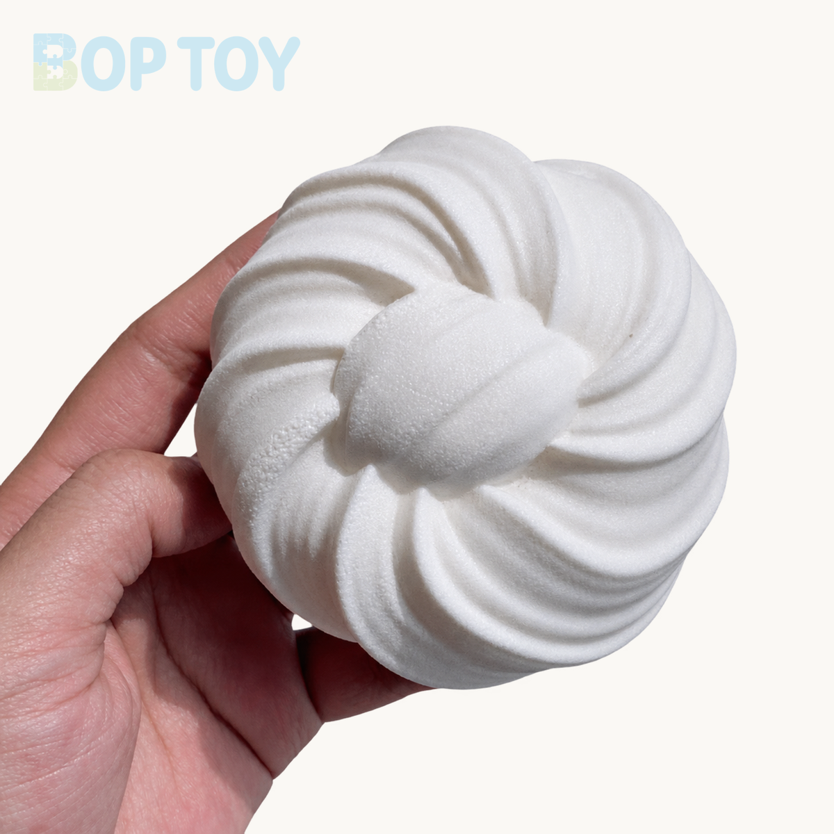 White spiral steamed bun held in hand; not a measurement guide