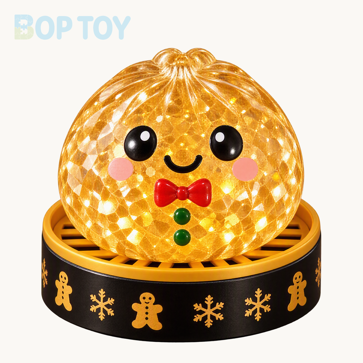Gingerbread Man bun squishy with red bowtie, green buttons and included black-and-gold steamer