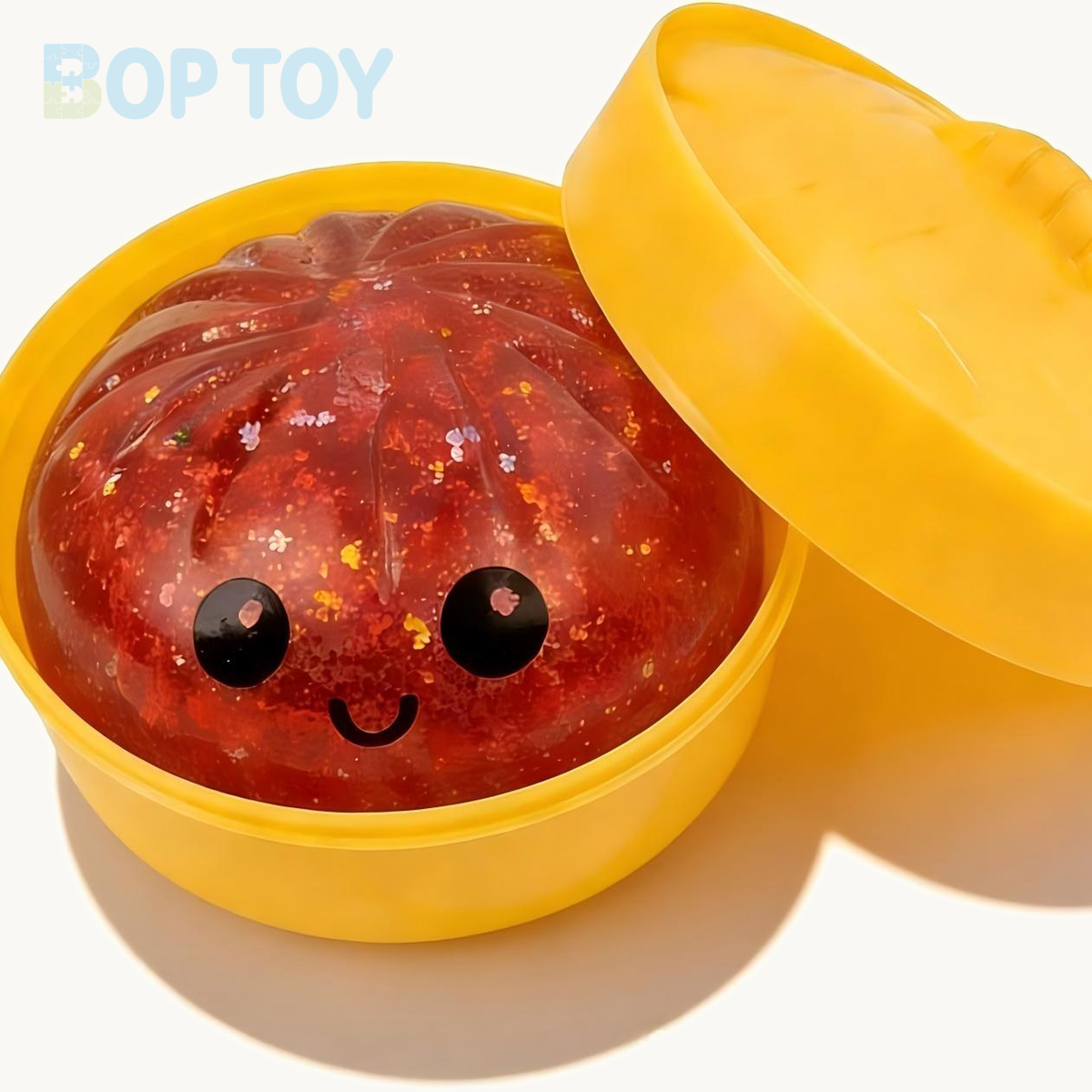 Red bun squishy with yellow steamer and lid; one piece