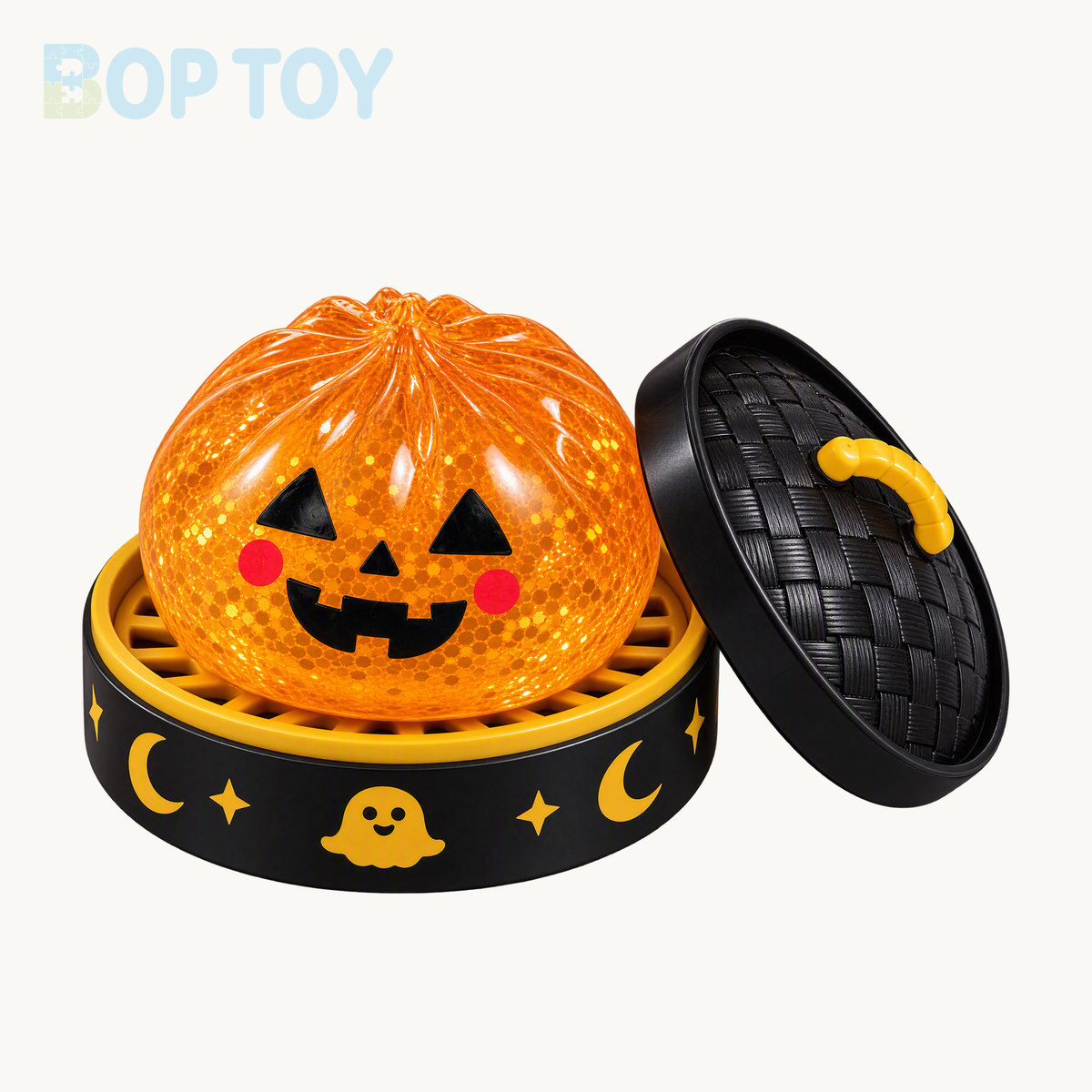 Orange pumpkin bun squishy with jack-o-lantern face, black and gold steamer and matching lid