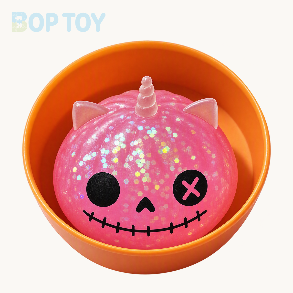Pink mini Halloween unicorn glitter squishy with included orange container
