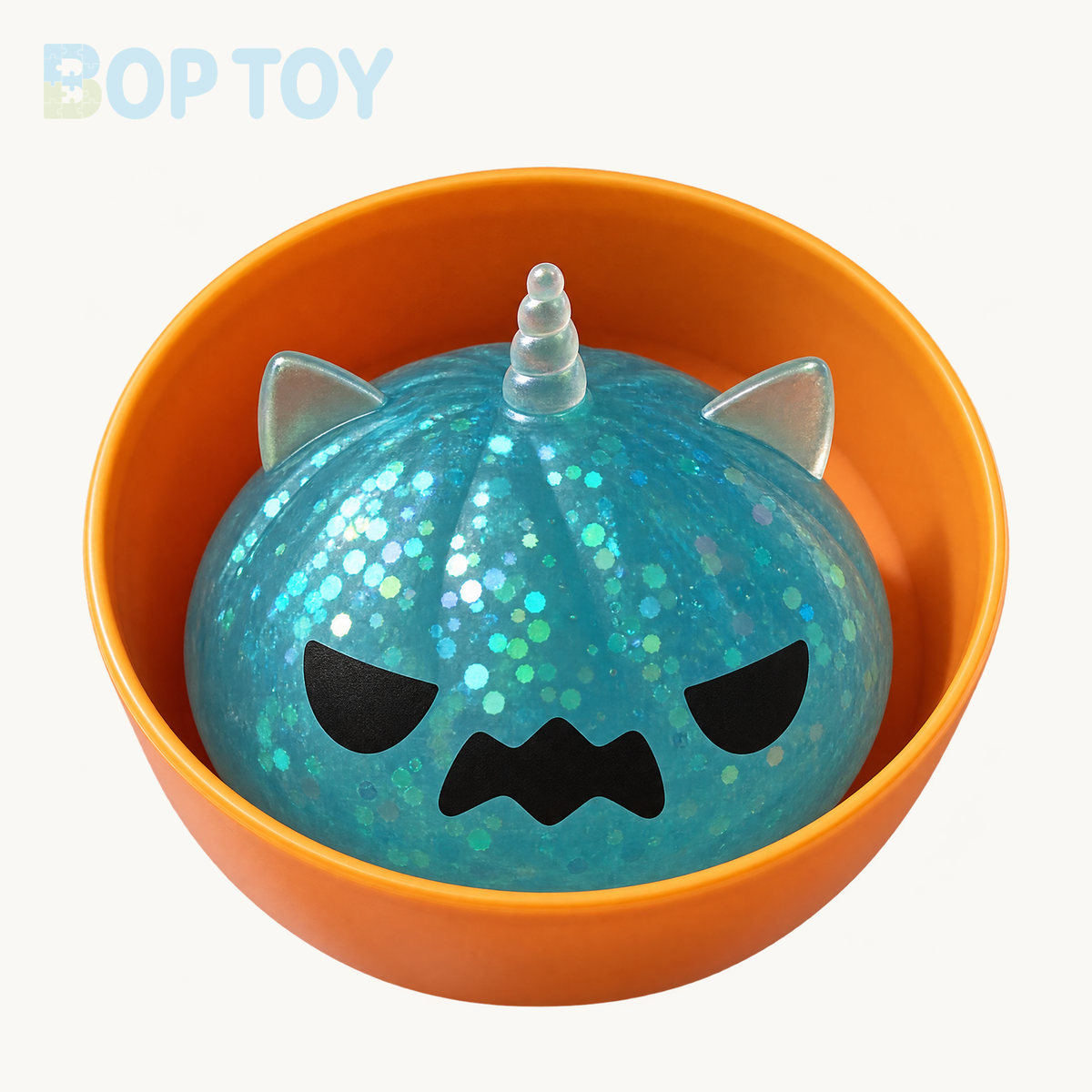 Blue mini Halloween unicorn glitter squishy with included orange container