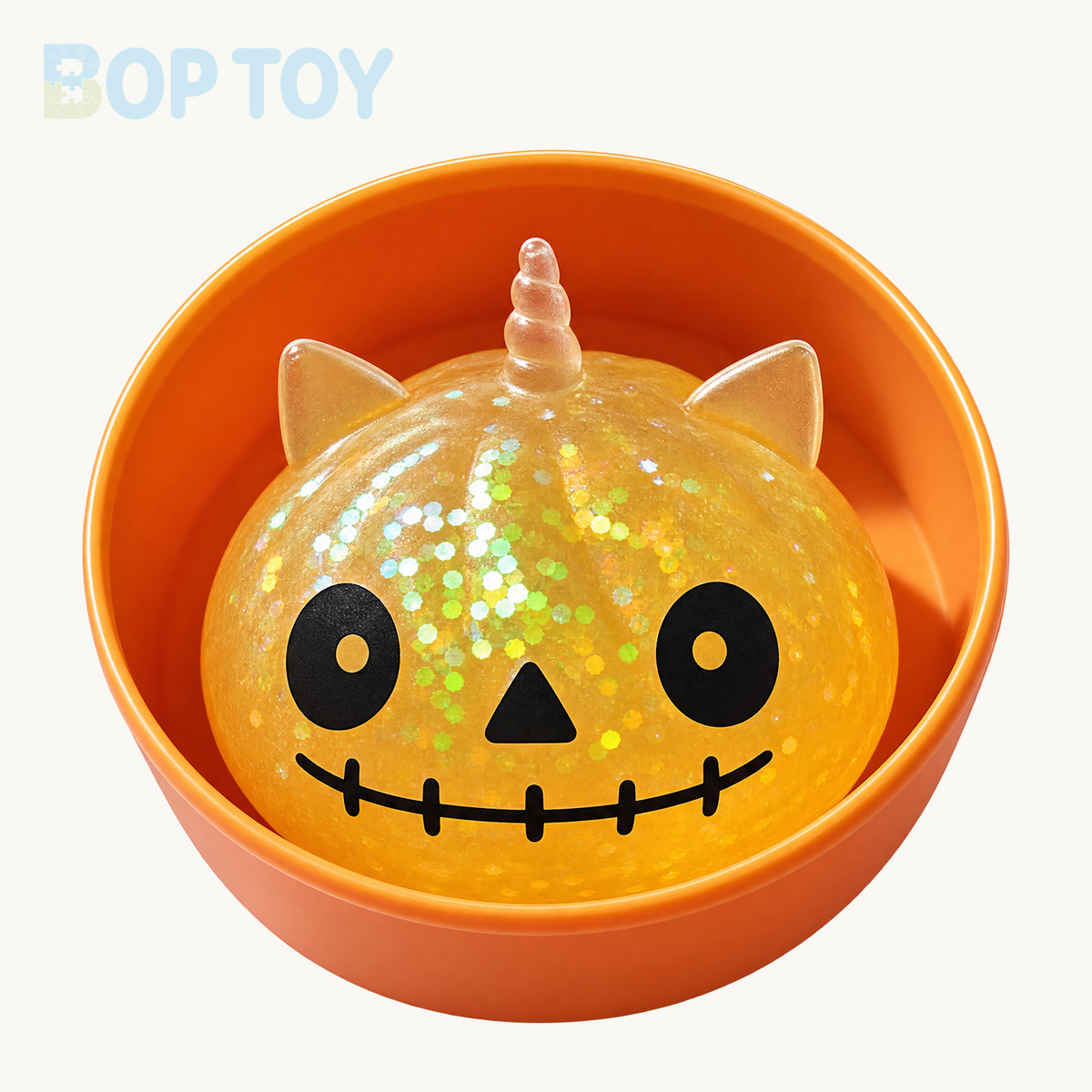 Yellow mini Halloween unicorn glitter squishy with included orange container