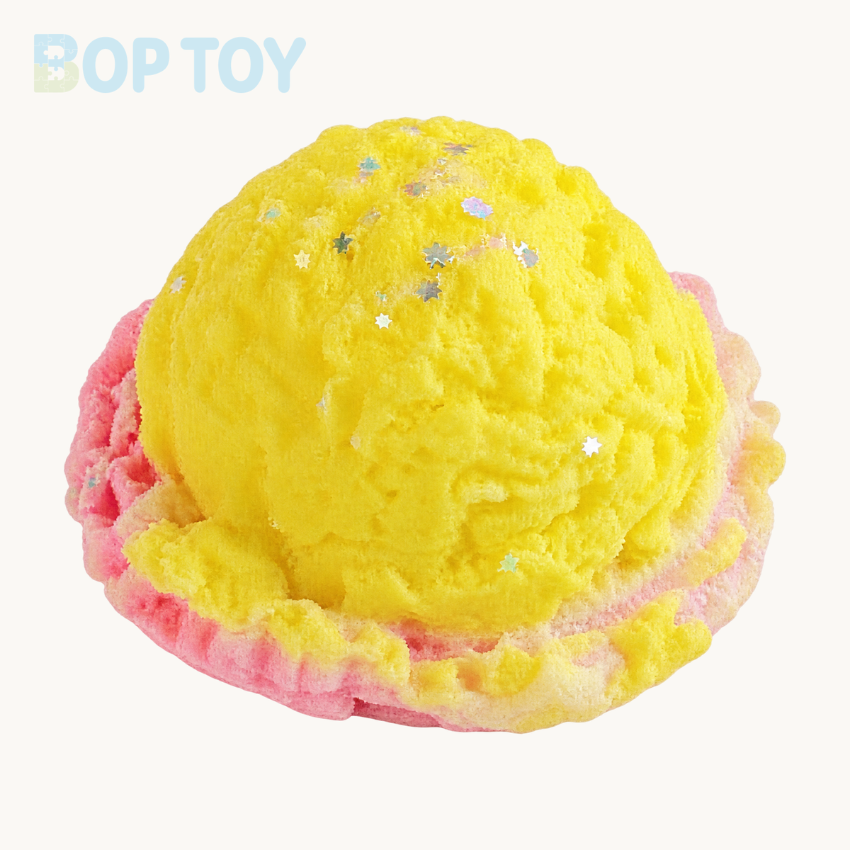 Yellow ice cream scoop squishy toy on BOPTOY cream background