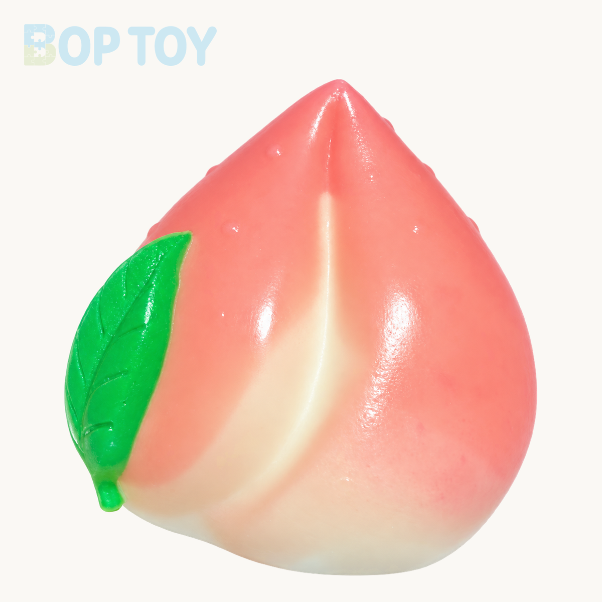 Peach Taba Squishy Toy — Pink Peach on BOPTOY cream background