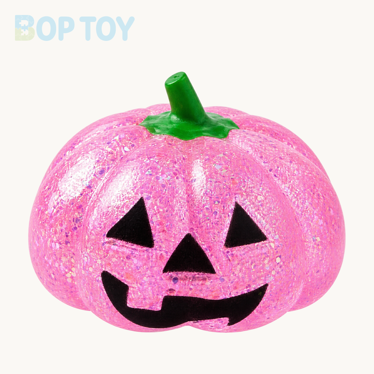 Pink glitter pumpkin squishy with green stem and black jack-o-lantern face; packaging depends on selected option