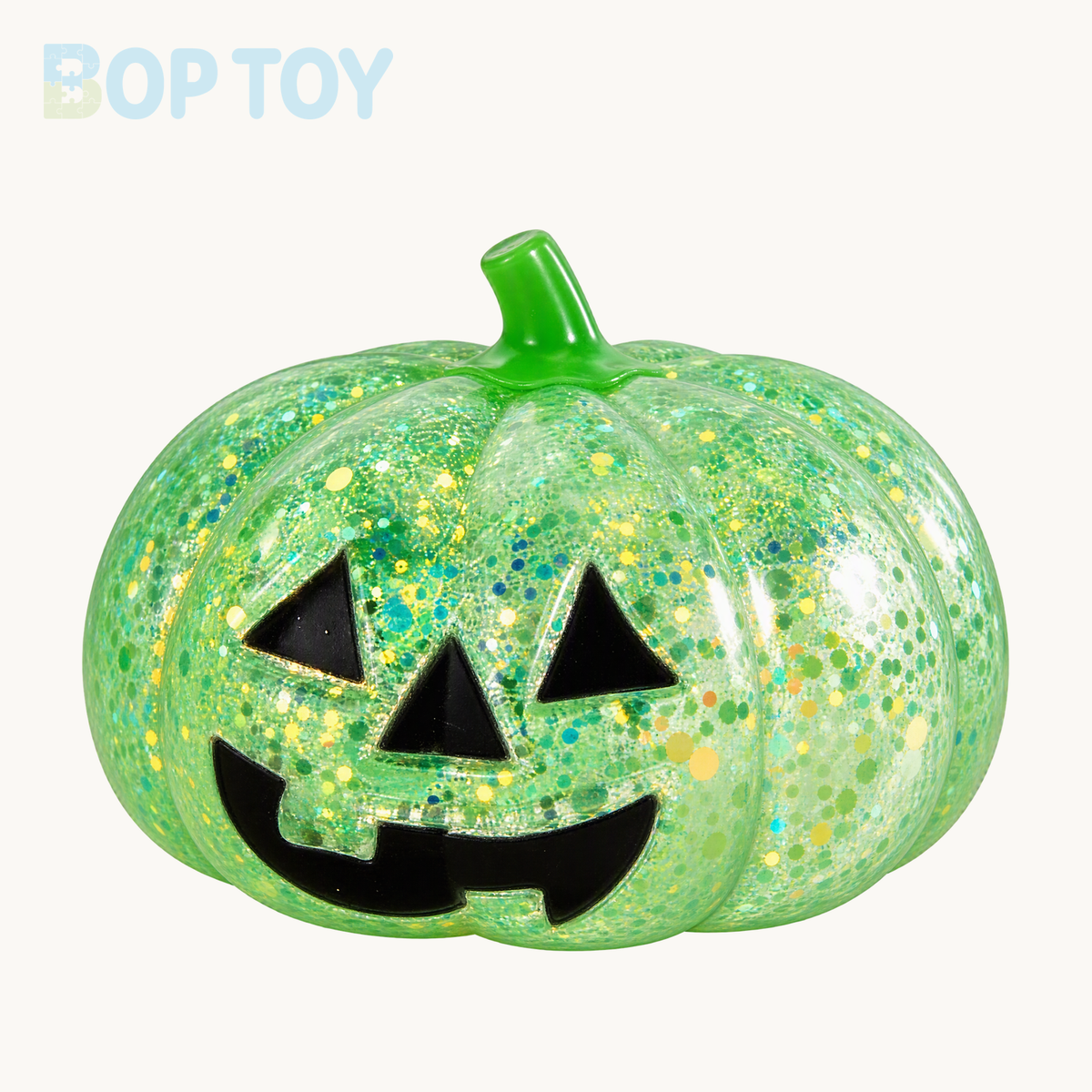 Green glitter pumpkin squishy with green stem and black jack-o-lantern face; packaging depends on selected option