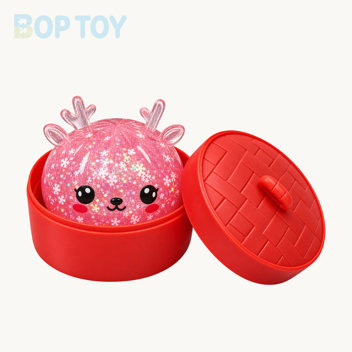 Pink Christmas reindeer glitter squishy color example with included red steamer base and woven-pattern lid; single color is random