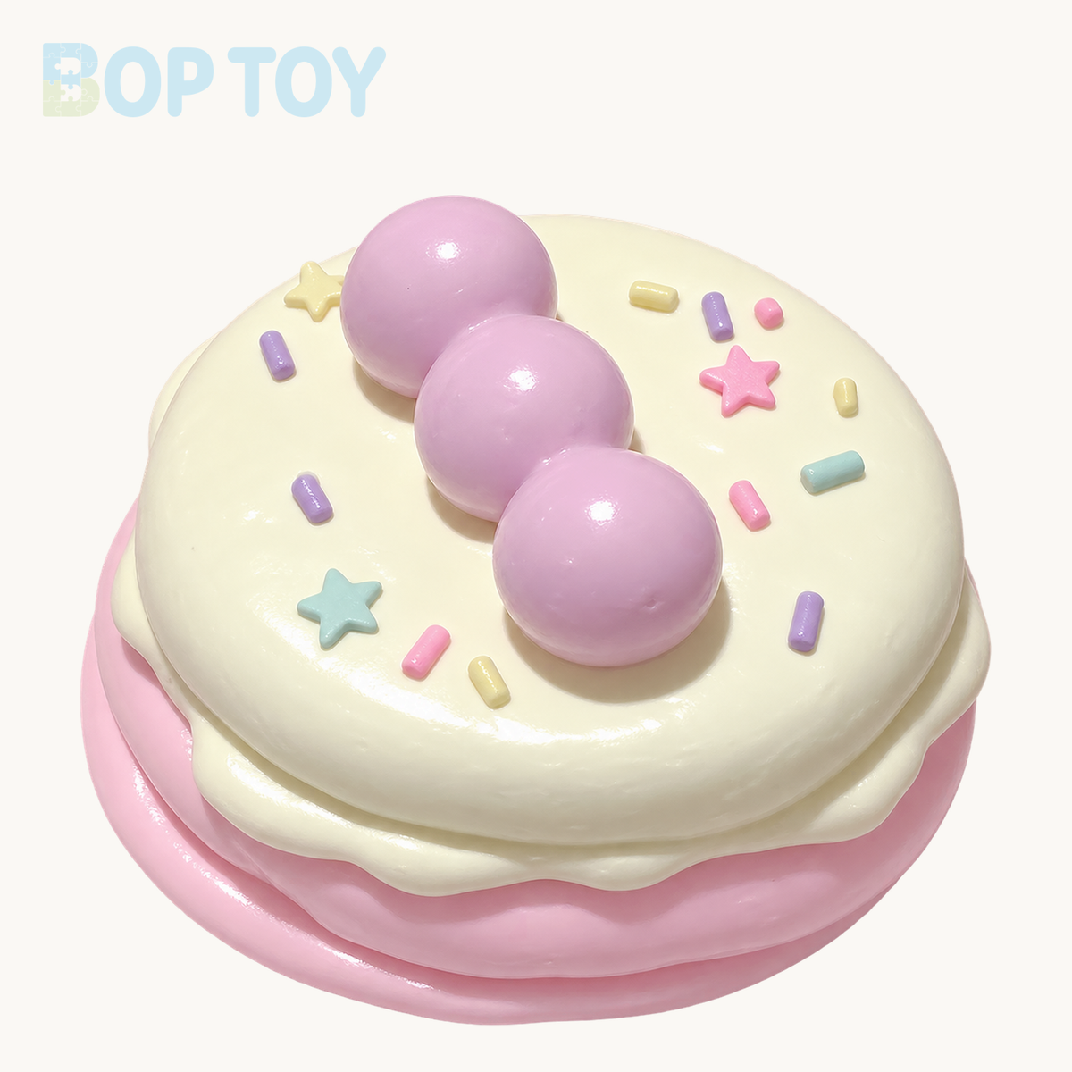 pink handmade silicone souffle cake squishy on BOPTOY cream background