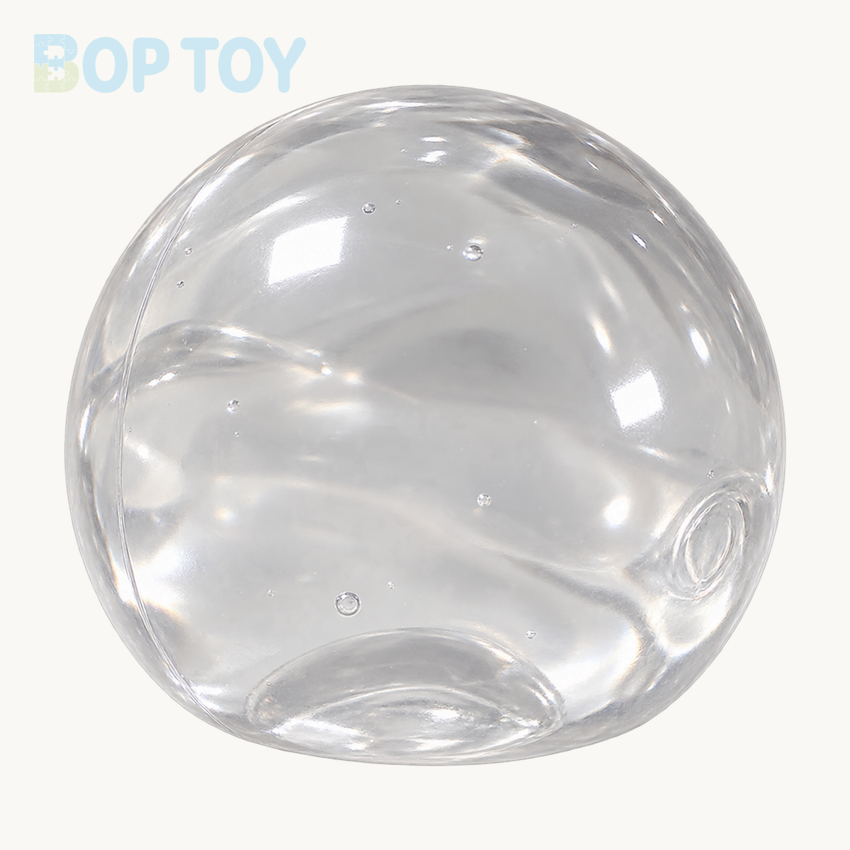 One clear transparent soft stress ball on BOP TOY cream background, no hand
