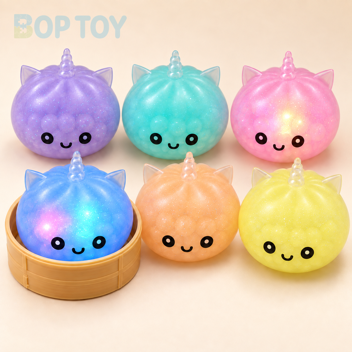 Light-up unicorn bun squishy color examples; sold as one random-color toy plus steamer, not six pieces