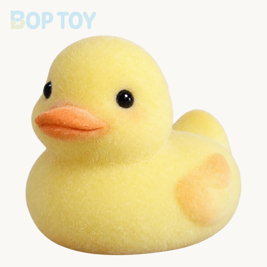 Yellow flocked duck taba squishy toy on BOPTOY cream background