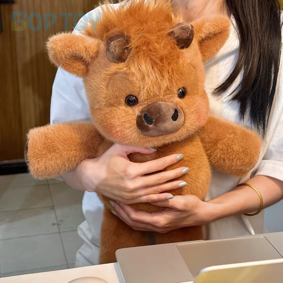Original product photograph of the maillard Highland cow plush
