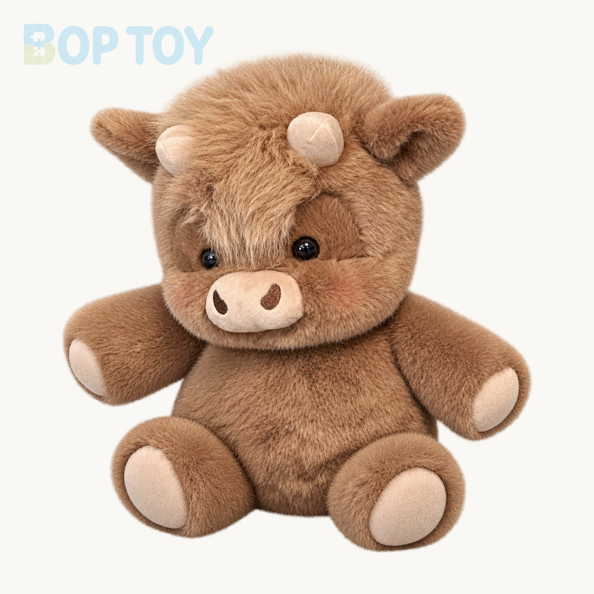 Mocha fluffy Highland calf plush on a warm ivory background