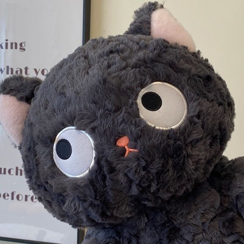 Jiji the Fluffy Black Cat Plushie Laying Down — image 3