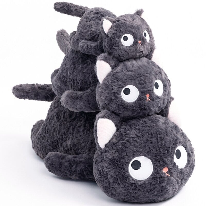 Jiji the Fluffy Black Cat Plushie Laying Down — image 1