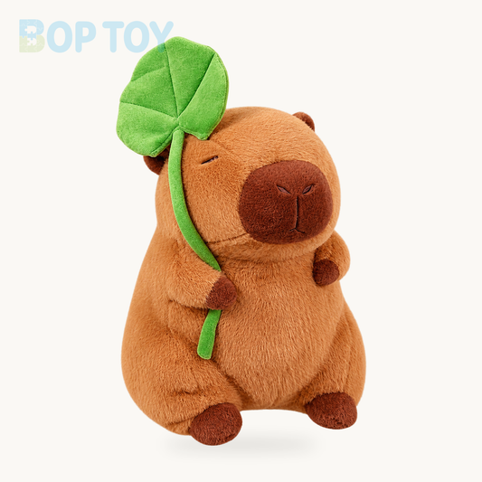 Kawaii Capybara Plushie Holding Leaf product collection on a cream background