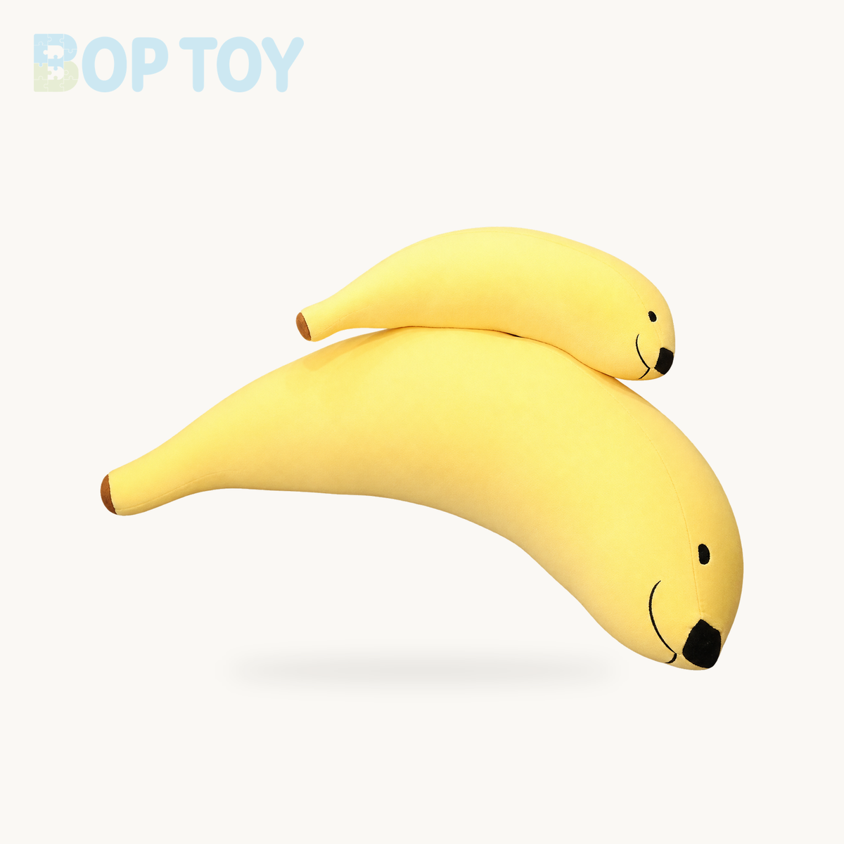 Funny Banana Dog Plushie, 5-35" | 12-90 cm product selection on a cream background